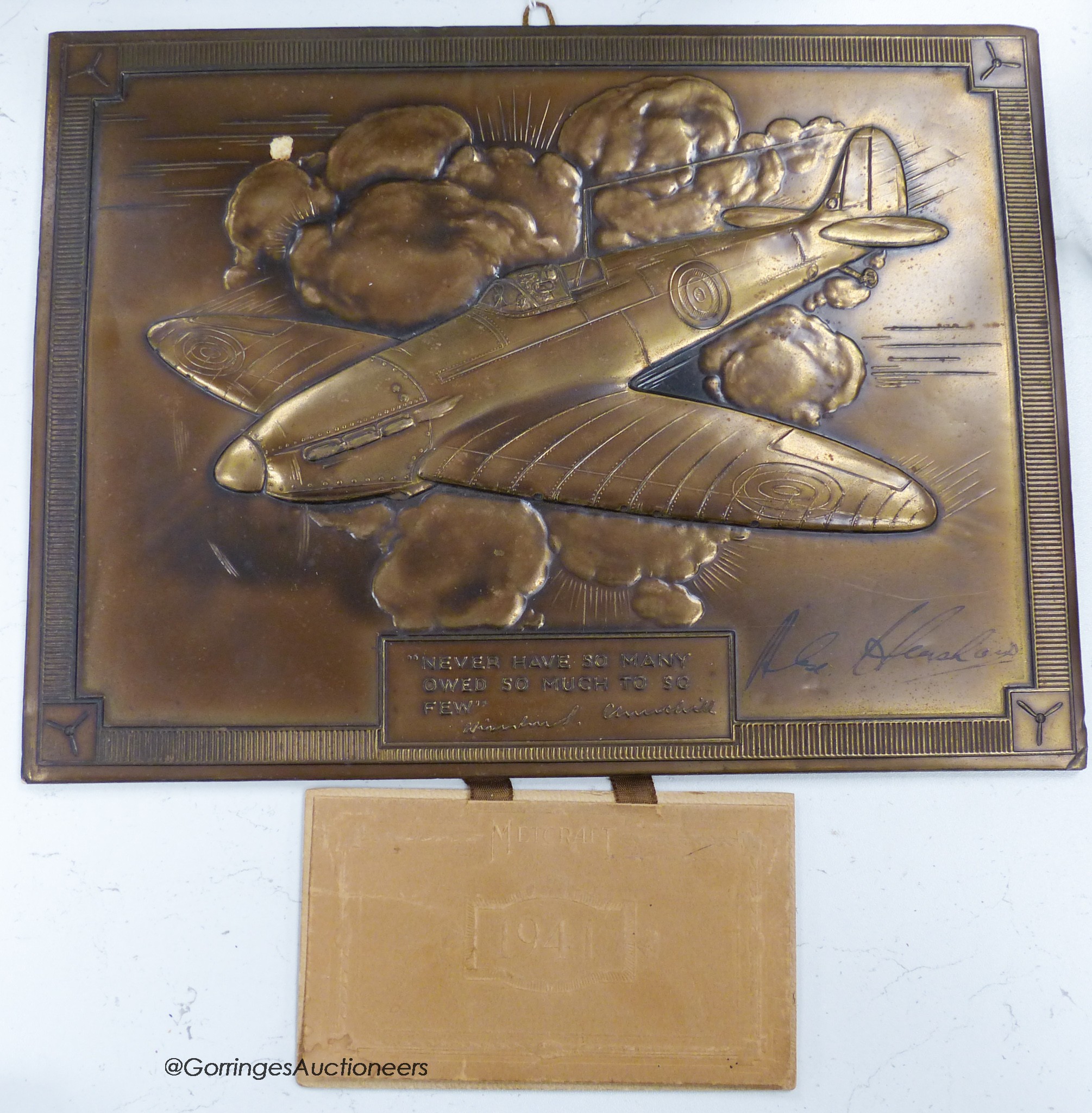 A 1941 calender, bronze finish signed by Alex Henshaw, air racer and test pilot for Vickers Armstrong